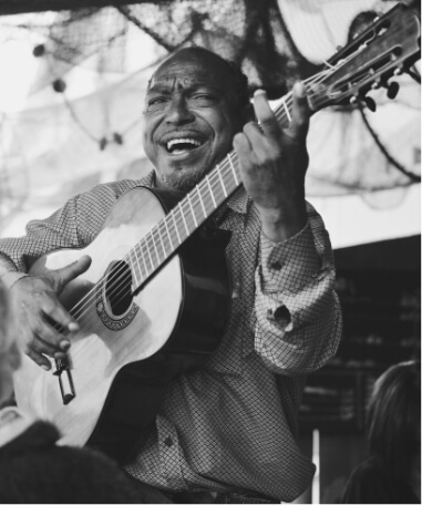man singing with guitar