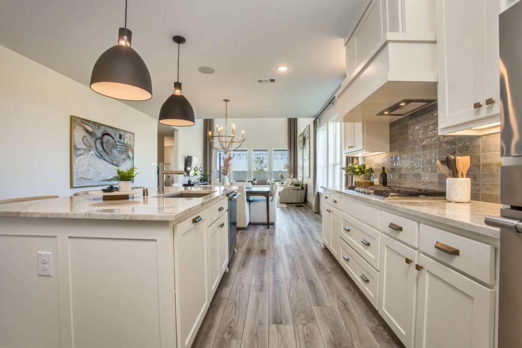 A McKinney, Texas kitchen with white cabinets and hardwood floors.