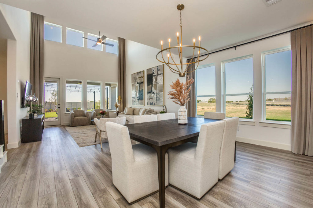 A Texas living room with hardwood floors and a dining table, blending harmoniously with the surrounding nature of McKinney.