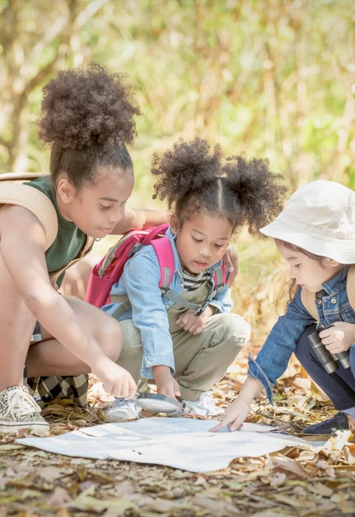 young students exploring nature