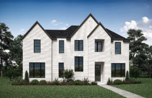 A two-story white brick house with a dark roof, large windows, and a landscaped front yard sits under the blue Texas sky in Painted Tree's new homes development in McKinney.