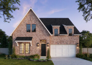 A two-story brick house with a triangular roof, front porch, and a white double garage door, nestled in the serene surroundings of McKinney, TX. The manicured lawn and trees frame this Southgate Homes property perfectly. It's dusk, and the house lights softly illuminate the welcoming facade.