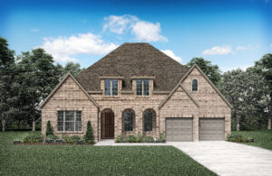 A brown brick house with a steep gabled roof, double garage, and arched front entrance is surrounded by a lawn and trees under a clear blue sky in charming McKinney. This new home invites you to discover the serene beauty of Painted Tree, TX.