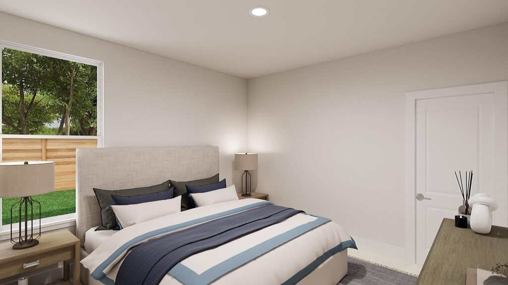 A modern bedroom in Painted Tree McKinney, featuring a neatly made bed, two nightstands with lamps, a window with lush greenery outside, and a closed white door.