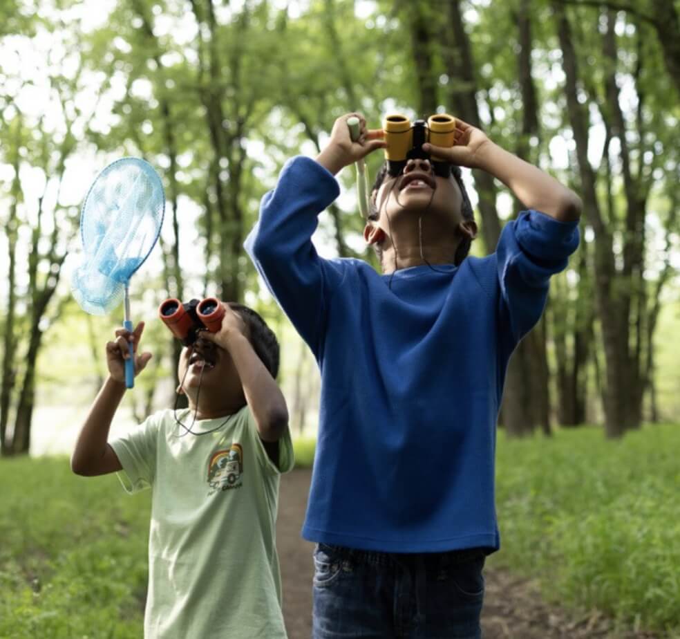 Two children exploring nature.