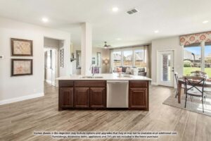 Open-concept kitchen with a central island, dark wood cabinets, and stainless steel appliances in Painted Tree McKinney. Adjacent dining and living areas feature large windows overlooking the backyard—perfect for homes for sale in McKinney, Texas.