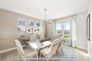 Bright dining room with a rectangular table, eight chairs, chandelier, large window with light curtains, and decorative mirrors—perfect for gatherings in beautiful Painted Tree McKinney homes for sale.
