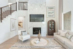 Modern living room with a marble accent wall, mounted TV, fireplace, neutral furniture, glass cabinet, and staircase with metal railing—perfect for those seeking painted tree homes for sale in McKinney, Texas.