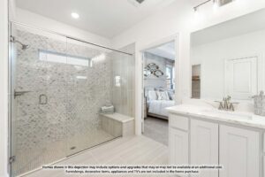 Modern bathroom with glass-enclosed shower, white vanity with dual sinks, and view into a furnished bedroom—showcasing stylish living in Painted Tree TX. Text disclaimer visible at the bottom of the image.