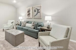 A modern living room with a light gray sofa, two patterned armchairs, side tables with lamps, wall art, and neutral carpeting—perfect for relaxing in stylish Painted Tree McKinney homes for sale.