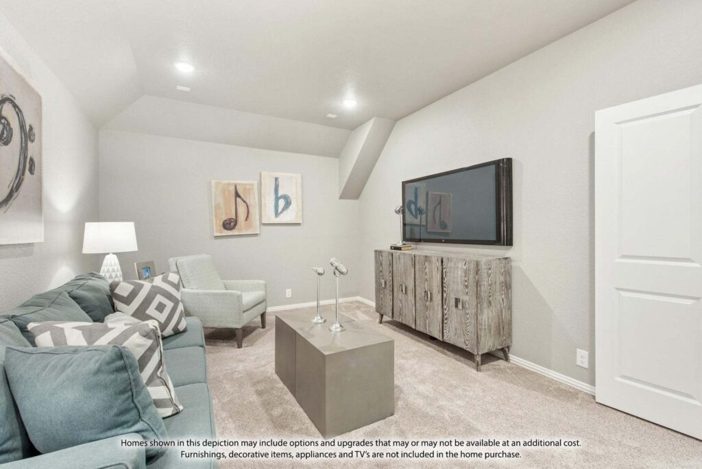 A modern living room with light gray walls, a blue sofa, two armchairs, a rustic TV console, and wall art; perfect inspiration for those seeking stylish homes for sale in McKinney Texas. A flat-screen TV is mounted on the wall.