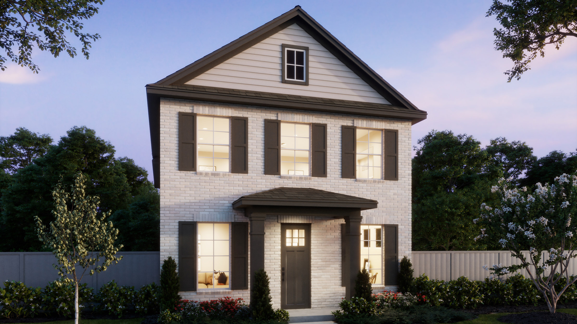 A two-story Normandy Homes house with a white brick exterior, dark shutters, and a covered front entrance, surrounded by greenery and a fenced yard in McKinney’s Painted Tree community at dusk.
